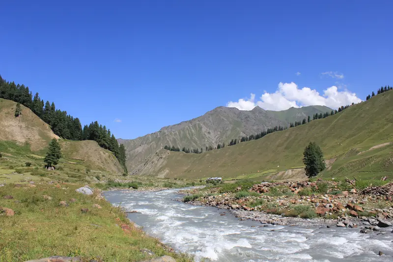 Green hillsides dropping to the Kishanganga in Gurez